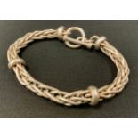 A Gentleman's fancy link silver bracelet, bar and loop clasp. 25cm long, 75.8g