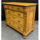 A country house pine chest of drawers, oversailing rectangular top, above four long drawers, brass