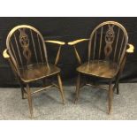 A pair of Ercol Fleur De Lys Windsor carver chairs, Old Colonial range c.1965