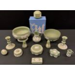 Wedgwood - a pale green pedestal bowl, 23cm diameter, another 20cm; pair of candlesticks, Prince