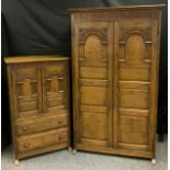 A Titchmarsh & Goodwin Gothic oak four piece bedroom suite comprising double wardrobe, with out