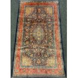 A Persian Sarough rug / carpet, having a diamond shaped medallion within a central field densely