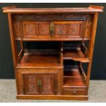 A Chinese Padauk wood display cabinet, the sleigh-form top above an arrangement of small cupboards