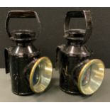 A pair of modern railway signalling lamps, black metal cases, revolving lens covers (2)