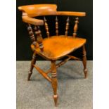 A late 19th/early 20th century smokers bow, turned spindles, shaped seat, H stretcher, c.1910