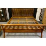 A mahogany Super King size sleigh bed.
