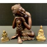 Asian School, brass, a Buddha, 13cm high; another, smaller; a resin sleeping Buddha (3)