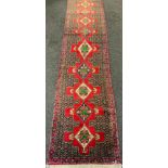 A Fine Persian hand-made Senneh runner carpet, 382cm x 92cm.