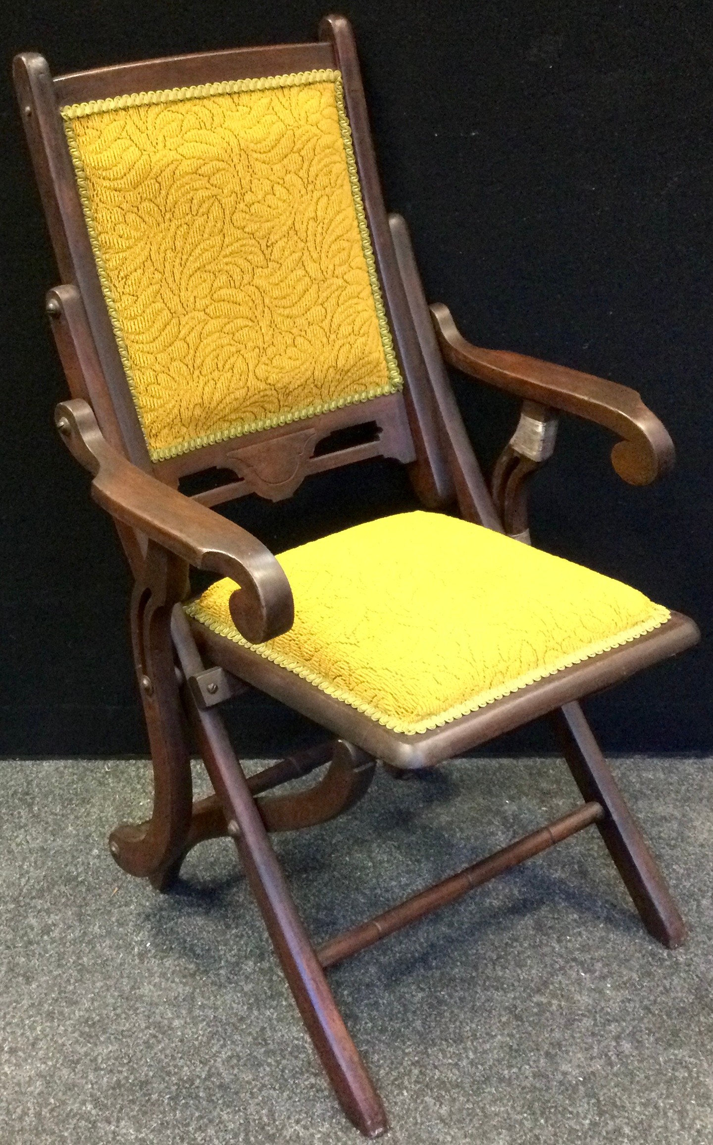 A late Victorian mahogany Art Nouveau steaming chair, scrolling arms, 89cm high