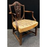 A 19th century mahogany shield back elbow chair, stuffed-over tapestry seat, c.1790