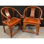 A Pair of Chinese carved Padauk-type wood Scholars' side chairs, curved back-rail with scrolled