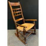 A 19th century rocking chair, wicker seat, c.1860