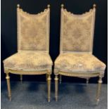 A pair of French giltwood side chairs, stuffed over backs and seats, fluted tapered legs, c.1860