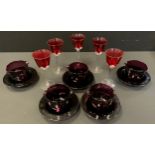 A set of five amethyst glass rinses and stands; a set of five ruby wine glasses