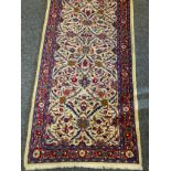 A Fine Persian hand-made Brojerd runner carpet, woven in shades of red, mauve, and deep blue, on a