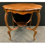 An early 20th century walnut shaped circular side table, central shelf, carved scroll legs, 78cm