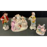 A 19th century continental porcelain figure group, Lord and Ladies at Tea, painted crossed Sissors