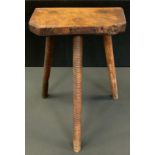 A 19th century rustic stool, three turned legs, 62cm high