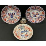 A pair of Japanese Imari shaped circular wall plates, 30cm diam, Meiji period; another, with