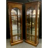 A pair of contemporary mahogany and glass display cabinets, glazed doors and sides, mirrored