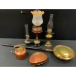 A Victorian brass and copper oil lamp; another; a copper warming pan; copper camping kettle; etc