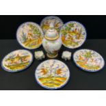 Ceramics - a set of six Continental faience pottery circular wall plaques, 28.5cm and smaller;