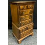 A George III style reproduction bijou side cabinet in the form of a chest on chest, 76cm tall x 38cm