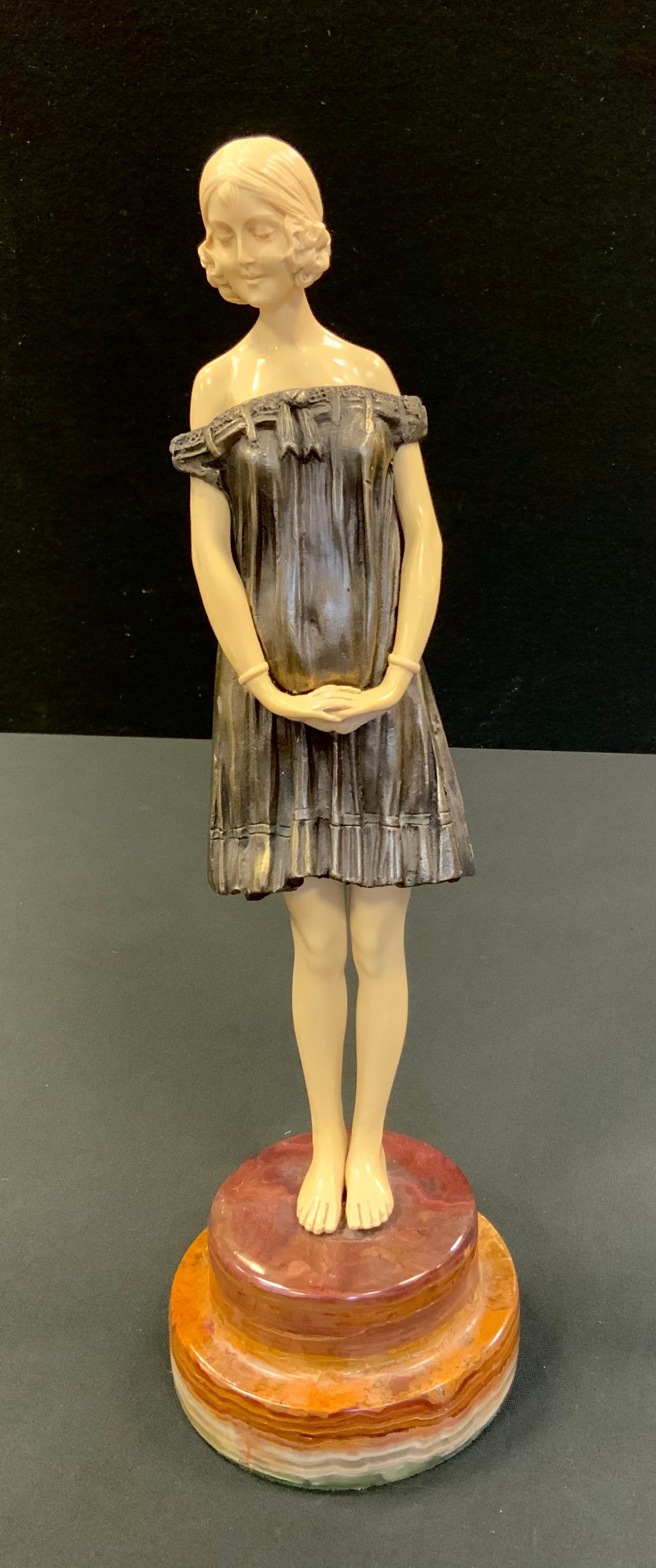 Demetre Chiparus (1886-1947), after, Bronze coloured metal and faux ivory figure, Innocence, stepped