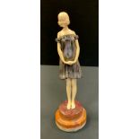 Demetre Chiparus (1886-1947), after, Bronze coloured metal and faux ivory figure, Innocence, stepped