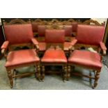 A set of eight Gothic revival oak dining chairs (six chairs and two carvers), red leather backs