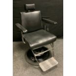 A mid 20th century rise and fall Barbers Chair.