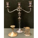 A George V silver christening mug, Birmingham 1911, 73.5g; silver candlestick, weighted base,