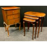 A walnut nest of three tables, quarter veneered, slender cabriole legs, 58cm high; a walnut Queen