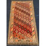 A Qashgai Kilim woolen rug, the large central field woven with diagonal bands of stylized