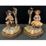 A pair of Capo di Monti Sartori figures, Seated boy with Shot gun & Seated Girl with Birds, signed