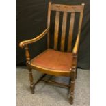 An early 20th century oak elbow chair, drop-in seat, turned legs, H-stretcher, 99cm high, 55cm wide.