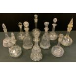 A near pair of 19th century bell bottom decanters; another similar; others etched and cut glass;