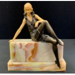 Ferdinand Preiss (1882-1943) after, Bronze coloured metal and faux ivory figure, Girl Seated on a