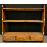 A 20th century oak plate rack, three graduated open shelves above three frieze drawers, 96.5cm high,