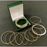 A silver interlaced twenty ring bracelet, stamped 925, boxed; others 925, silver coloured metal