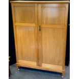 A mahogany gentleman's compactum wardrobe, two field panelled doors, fitted interior, 180cm high,