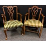 A 19th century Hepplewhite elbow chair; a Chippendale elbow chair (2)
