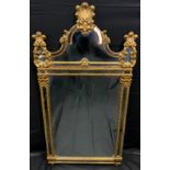 A neoclassical carved gilt framed wall mirror, arched shell crest, flat plate, 124cm high, 64cm wide