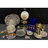 Plated ware - candelabrum; cake stand, goblets, egg stand; a brass oil lamp; etc