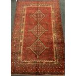 A fine Persian Shiraz woollen rug / carpet, woven with a triple row of medallions within a large