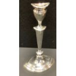 A silver Neo-Classical style candle stick of navette shape, detachable nozzle, vasular sconce,