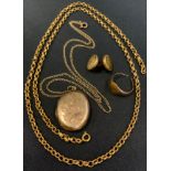 A 9ct gold oval locket pendant necklace; 9ct gold signet ring, 7.6 g gross; a gold plated necklace