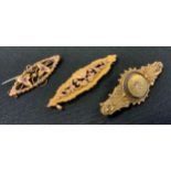 A 15ct gold diamond set brooch, missing pin, 4.1g gross; a 9ct gold oval panel brooch, another 3.