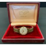 A 1960s Longines 9ct gold cased wristwatch, cream dial, Arabic numerals, subsidiary seconds,