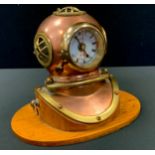 A novelty copper and brass divers helmet clock, 19cm high